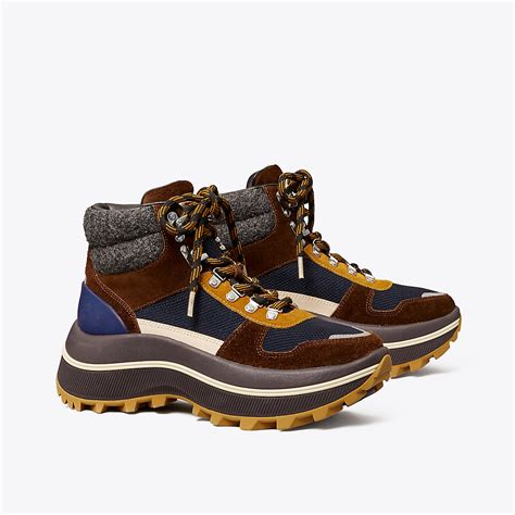 It is designed with an oversized flatform sole with sculptural curves and a tonal embossed Double T. . Tory burch adventure hiker